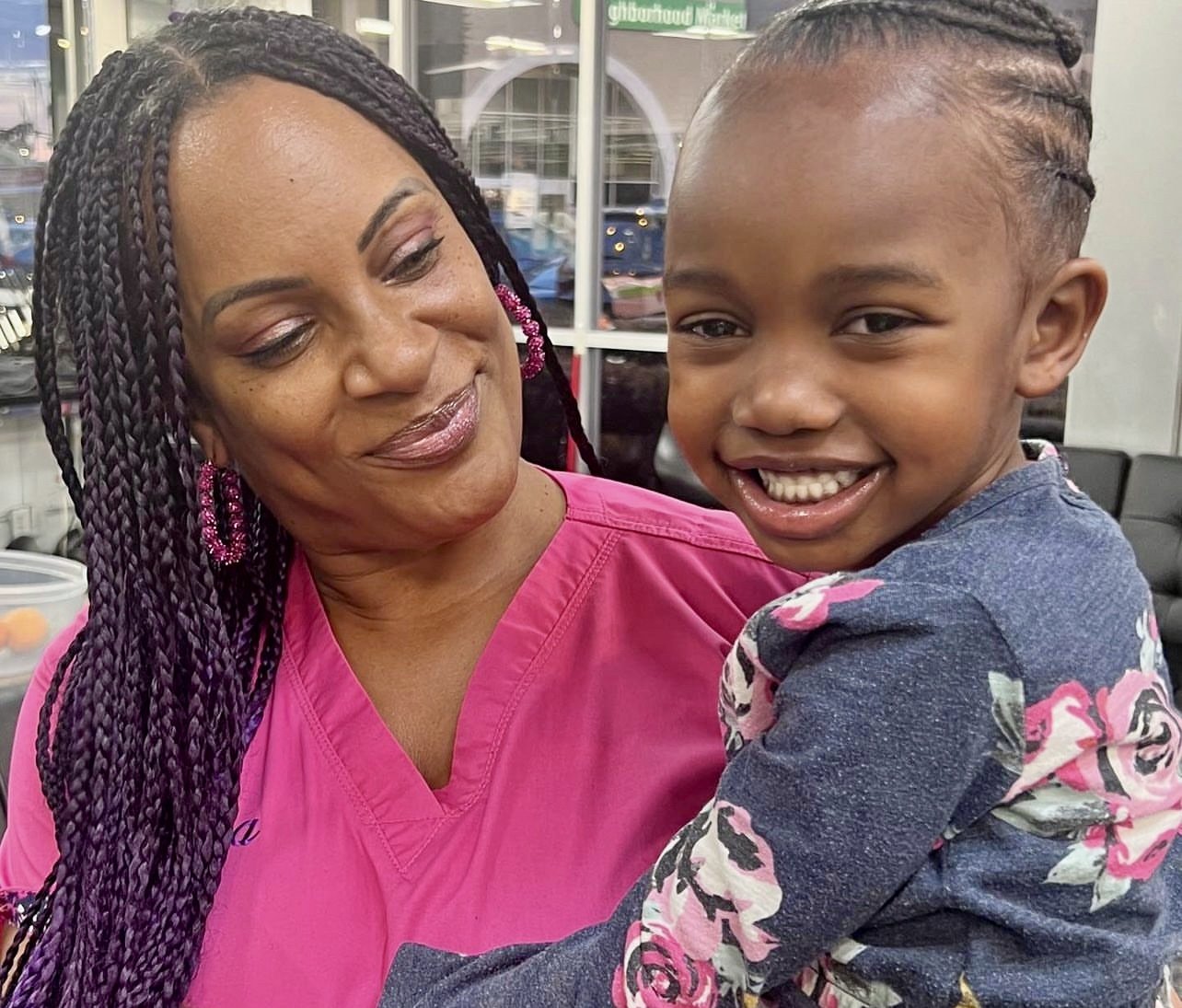 Sharing smiles after fresh braids